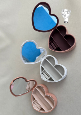 Heart-shaped plastic jewelry organizer with mirror