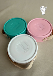 Round plastic jewelry organizer with secure closure and leather handle