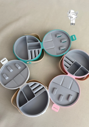 Round plastic jewelry organizer with secure closure and leather handle