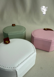 Round leather jewelry organizer with clasp closure and leather handle