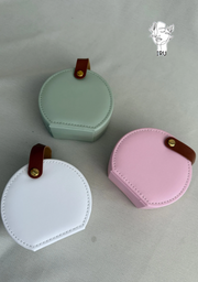 Round leather jewelry organizer with clasp closure and leather handle