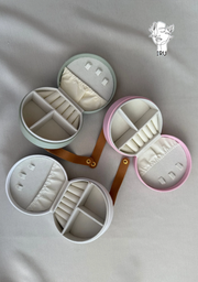 Round leather jewelry organizer with clasp closure and leather handle